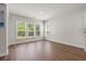 Bright, open living room showcasing wood floors and lots of natural light at 57 Eagle Claw Dr., Carolina Shores, NC 28467