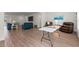 Open concept living room with wood floors offering ample space for relaxation and entertaining at 57 Eagle Claw Dr., Carolina Shores, NC 28467