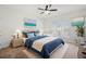 Serene main bedroom with stylish bedding, a ceiling fan, carpet floors, and plenty of natural light at 57 Eagle Claw Dr., Carolina Shores, NC 28467