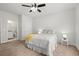 Spacious main bedroom with ensuite bathroom featuring neutral colors and carpet floors at 57 Eagle Claw Dr., Carolina Shores, NC 28467