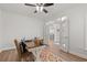 Bright home office with a wooden desk, rug, and French doors leading to other rooms at 57 Eagle Claw Dr., Carolina Shores, NC 28467
