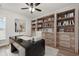 Stylish home office with built-in bookshelves, desk, and plenty of storage at 57 Eagle Claw Dr., Carolina Shores, NC 28467