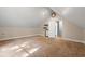 Finished attic space with neutral paint and carpet and built in shelves at 57 River Birch Ln., Pawleys Island, SC 29585