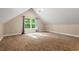 Finished attic space with neutral paint and carpet, bright with natural light at 57 River Birch Ln., Pawleys Island, SC 29585