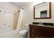 Bathroom featuring tub and shower with tile surround, a vanity with a granite countertop, and a toilet at 57 River Birch Ln., Pawleys Island, SC 29585
