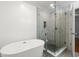 Elegant bathroom featuring a freestanding tub, glass-enclosed shower, and stylish tile flooring for a spa-like experience at 57 River Birch Ln., Pawleys Island, SC 29585