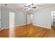 Cozy bedroom featuring hardwood floors and access to ensuite bathroom for a private and comfortable retreat at 57 River Birch Ln., Pawleys Island, SC 29585