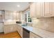 Bright kitchen with stainless steel appliances, granite counters, and plenty of storage space at 57 River Birch Ln., Pawleys Island, SC 29585