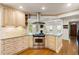 Elegant kitchen featuring a stainless steel oven and ample cabinet space, open to the spacious living area at 57 River Birch Ln., Pawleys Island, SC 29585