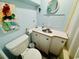 Bathroom featuring a nautical theme with light blue walls, a vanity, and toilet at 6001 - 1864 S Kings Hwy., Myrtle Beach, SC 29575