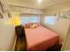 Serene bedroom offers a peaceful retreat with bright lighting and cozy accents at 6001 - 1864 S Kings Hwy., Myrtle Beach, SC 29575