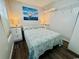 Cozy bedroom featuring a comfortable bed, nautical decor, and built-in shelving at 6001 - 1864 S Kings Hwy., Myrtle Beach, SC 29575