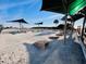 Cornhole boards set up on a sandy beach next to palm trees at 6001 - 1864 S Kings Hwy., Myrtle Beach, SC 29575