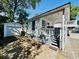 Charming coastal home with a welcoming front porch and detached garage, perfect for beach living at 6001 - 1864 S Kings Hwy., Myrtle Beach, SC 29575