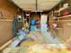 Garage with laundry machines, shelving, and a colorful rug covering the floor at 6001 - 1864 S Kings Hwy., Myrtle Beach, SC 29575
