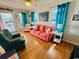 Inviting living room with comfortable seating, bright decor, and access to the outdoor porch at 6001 - 1864 S Kings Hwy., Myrtle Beach, SC 29575