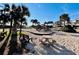 Beachside playground for with play equipment, seating, picnic table, and palm trees at 6001 - 1864 S Kings Hwy., Myrtle Beach, SC 29575