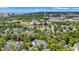 Expansive aerial view of the community showcasing lush greenery, buildings, and distant ocean views at 601 Hillside Dr. # 4424, North Myrtle Beach, SC 29582
