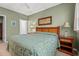 Serene bedroom showcasing a comfortable bed, soft lighting, and calming green walls at 601 Hillside Dr. # 4424, North Myrtle Beach, SC 29582