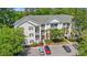View of a well-maintained condominium with manicured landscaping, ample parking, and private balconies at 601 Hillside Dr. # 4424, North Myrtle Beach, SC 29582
