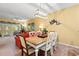 Inviting dining area featuring a wooden table with seating for six, open to the living room at 601 Hillside Dr. # 4424, North Myrtle Beach, SC 29582