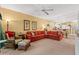 Spacious living room features a large red sectional sofa and an inviting open floor plan at 601 Hillside Dr. # 4424, North Myrtle Beach, SC 29582
