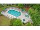 Aerial view of a community pool with ample lounge chairs and lush landscaping at 601 Hillside Dr. # 4424, North Myrtle Beach, SC 29582