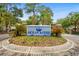 Welcome to Ocean Keyes! An inviting entrance with lush landscaping and a decorative sign at 601 Hillside Dr. # 4424, North Myrtle Beach, SC 29582