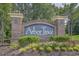Welcome to Arbor Trace! A beautiful community entrance with lush landscaping at 6015 Catalina Dr. # 332, North Myrtle Beach, SC 29582