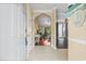 Inviting condo entrance with tile floors, stainless steel refrigerator and view into the living room at 6015 Catalina Dr. # 332, North Myrtle Beach, SC 29582