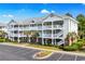 Stunning three-story condo building featuring private balconies and well-maintained landscaping at 6015 Catalina Dr. # 332, North Myrtle Beach, SC 29582
