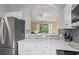 Modern kitchen with stainless steel appliances, quartz countertops, and decorative backsplash at 6015 Catalina Dr. # 332, North Myrtle Beach, SC 29582