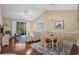 Cozy living room with hardwood floors, vaulted ceiling, and access to a balcony at 6015 Catalina Dr. # 332, North Myrtle Beach, SC 29582