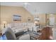 Spacious living room with a comfortable sofa, hardwood floors, and vaulted ceiling at 6015 Catalina Dr. # 332, North Myrtle Beach, SC 29582