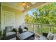 Relaxing covered porch featuring comfortable seating and a view of mature trees at 6015 Catalina Dr. # 332, North Myrtle Beach, SC 29582