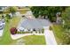 Aerial view of a well-maintained single-story home with lush landscaping near a tranquil pond at 605 Cavandish Dr., Myrtle Beach, SC 29588