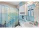 This bathroom offers a cute, decorated shower with matching sink, mirror, and towels for a coordinated look at 605 Cavandish Dr., Myrtle Beach, SC 29588