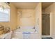 Inviting bathroom with soaking tub, walk-in shower, and beach-inspired accents at 605 Cavandish Dr., Myrtle Beach, SC 29588