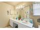 Bright bathroom featuring double sinks, vanity, and coastal-themed decor at 605 Cavandish Dr., Myrtle Beach, SC 29588