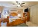 Cozy bedroom with wooden furniture, ceiling fan, and neutral color scheme at 605 Cavandish Dr., Myrtle Beach, SC 29588
