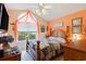 Cozy bedroom with vaulted ceiling, natural light, and warm, inviting decor at 605 Cavandish Dr., Myrtle Beach, SC 29588
