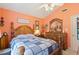 Cozy bedroom features a beautiful wooden bed frame, a large dresser, and a ceiling fan for added comfort at 605 Cavandish Dr., Myrtle Beach, SC 29588