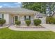 Inviting front porch with white picket fence and manicured shrubbery at 605 Cavandish Dr., Myrtle Beach, SC 29588