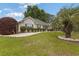 Charming home with a landscaped front yard, complemented by a lush lawn and a mature palm tree at 605 Cavandish Dr., Myrtle Beach, SC 29588