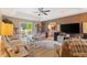 Spacious living room with tray ceiling, ceiling fan and sliding glass door at 605 Cavandish Dr., Myrtle Beach, SC 29588