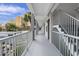 Exterior hallway with views of the palms on a bright sunny day at 6803 N Ocean Blvd. # 228, Myrtle Beach, SC 29572