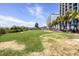 Relax on this spacious lawn with palm trees, beach access and nearby lounge chairs, perfect for outdoor enjoyment at 6803 N Ocean Blvd. # 228, Myrtle Beach, SC 29572