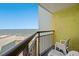 An inviting balcony offers a scenic view of the ocean and beach, perfect for relaxation at 6804 N Ocean Blvd. # 1013, Myrtle Beach, SC 29572