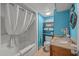 This stylish bathroom features a shower-tub combo with ample storage for toiletries at 6804 N Ocean Blvd. # 1013, Myrtle Beach, SC 29572