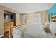 A relaxing primary bedroom offers great natural light and comforting decor at 6804 N Ocean Blvd. # 1013, Myrtle Beach, SC 29572